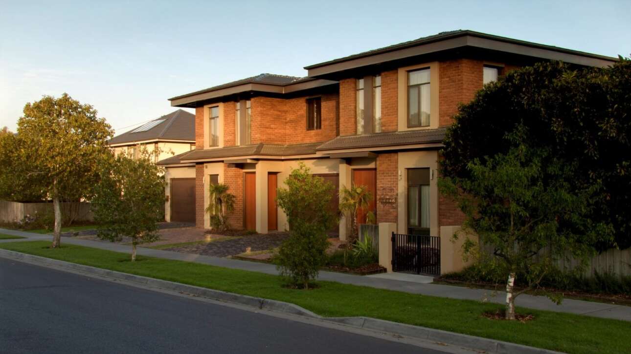 Modern attached duplex on a quiet NSW suburban street in Zone R2, the housing type now available as a CDC under the Low Rise Housing Diversity Code