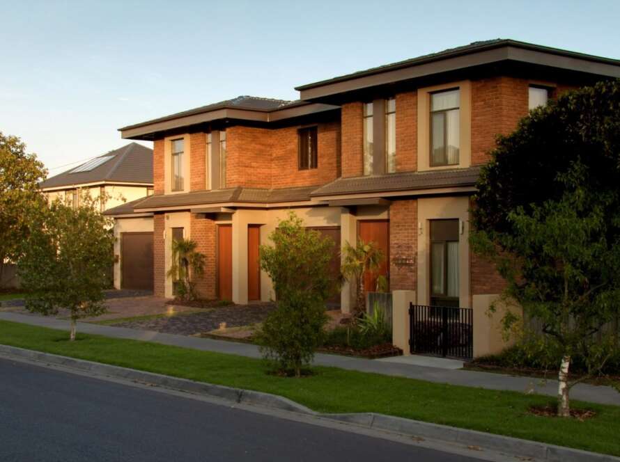Modern attached duplex on a quiet NSW suburban street in Zone R2, the housing type now available as a CDC under the Low Rise Housing Diversity Code